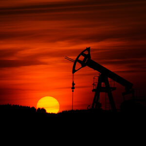 Oil derrick at sunset